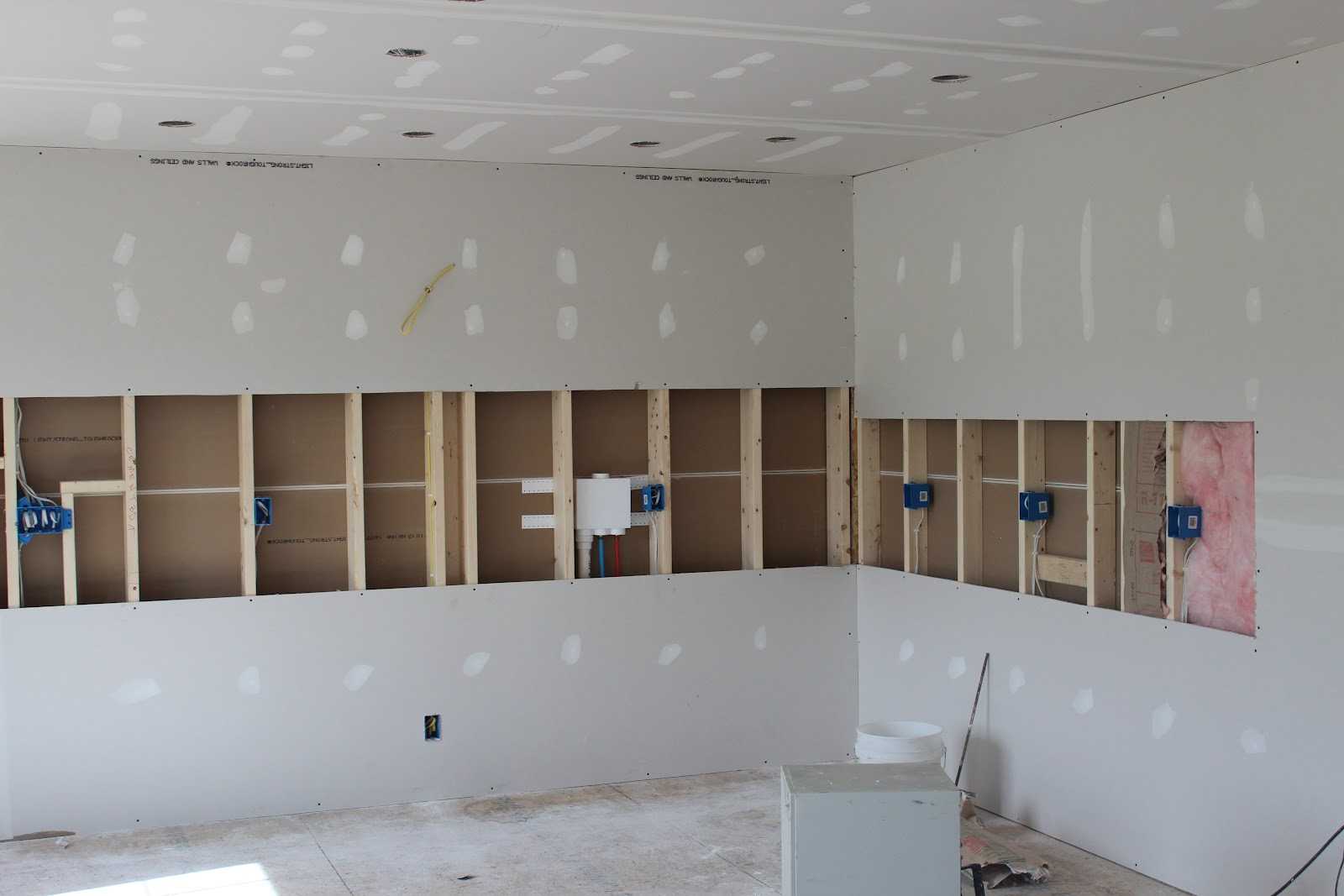 installing framing, insulation, and drywall